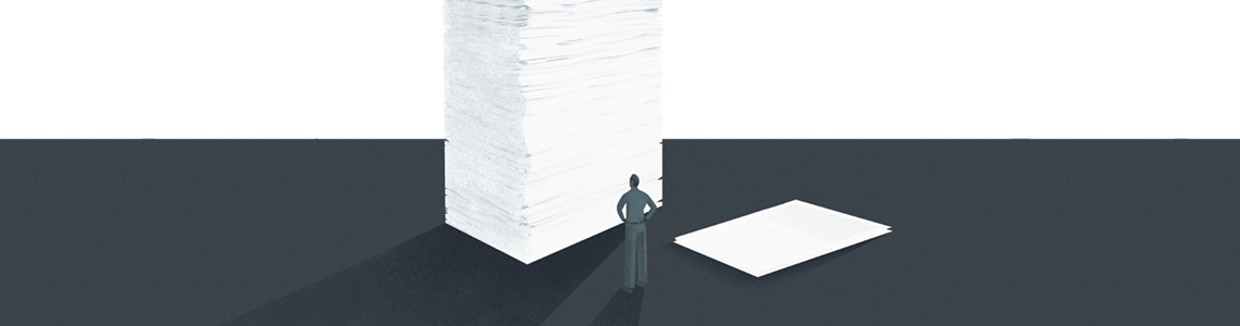 huge stack of paper next to a tiny stack